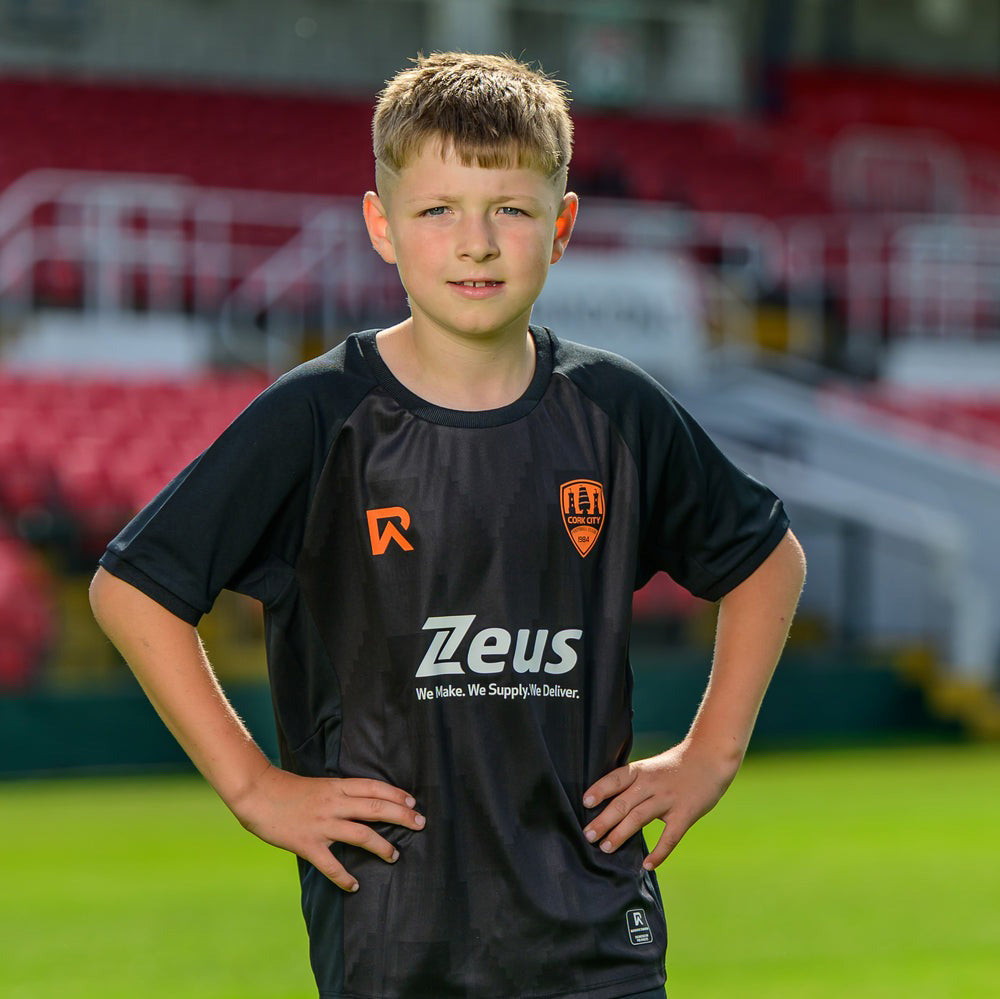 Rebel Army Cork City Football 2025/26 Kids Third Jersey Model Front View Pitch