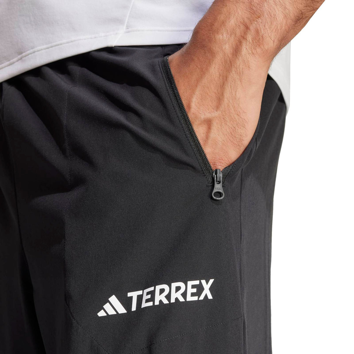 adidas Multi Essentials Stretch Mens Hiking Joggers Model Close-Up Pocket and Terrex Logo View