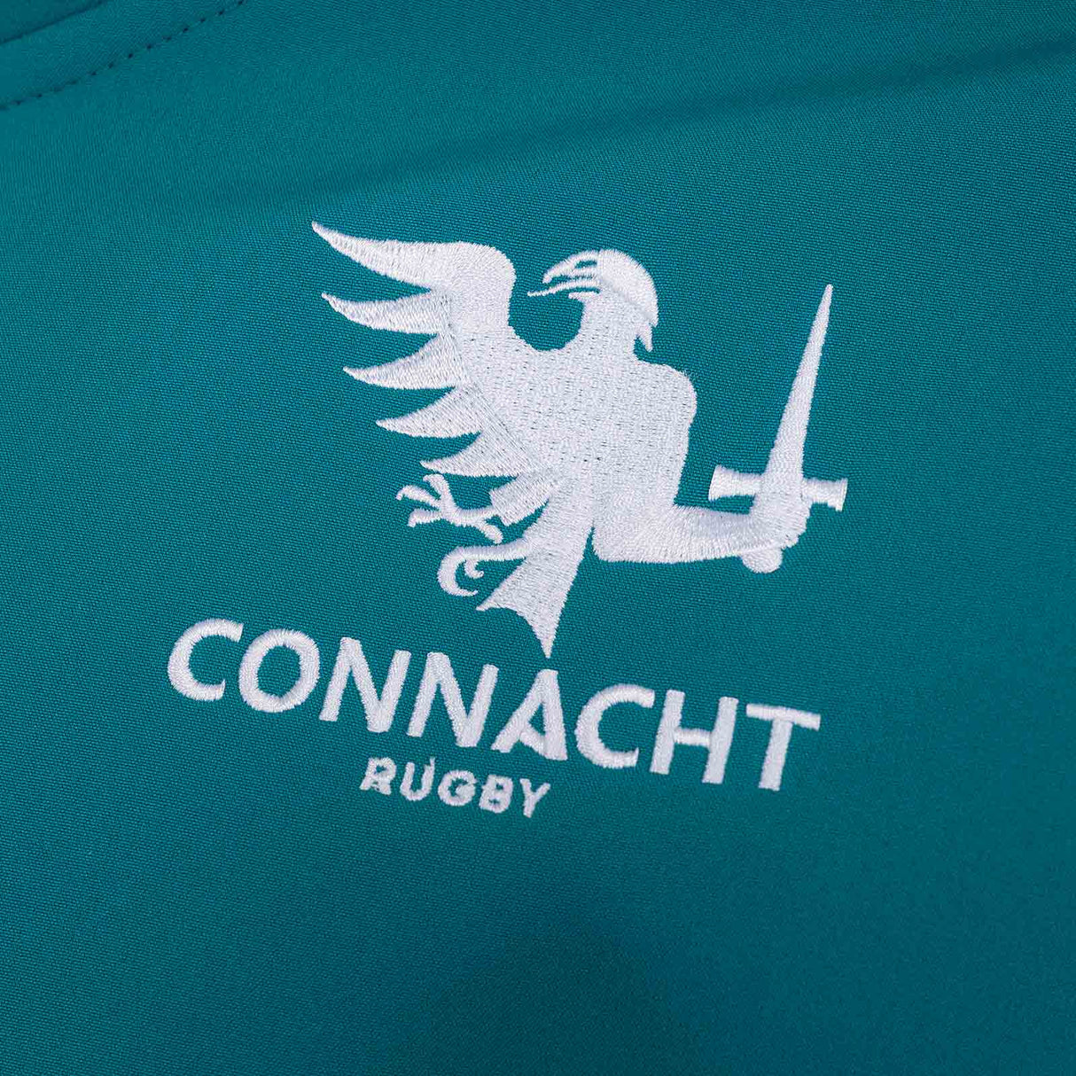 Macron Connacht Rugby 2025/26 Kids Softshell Training Jacket Close-Up Team Crest View