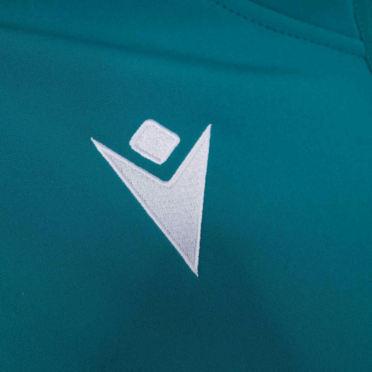 Macron Connacht Rugby 2025/26 Kids Softshell Training Jacket Close-Up Macron Branding View