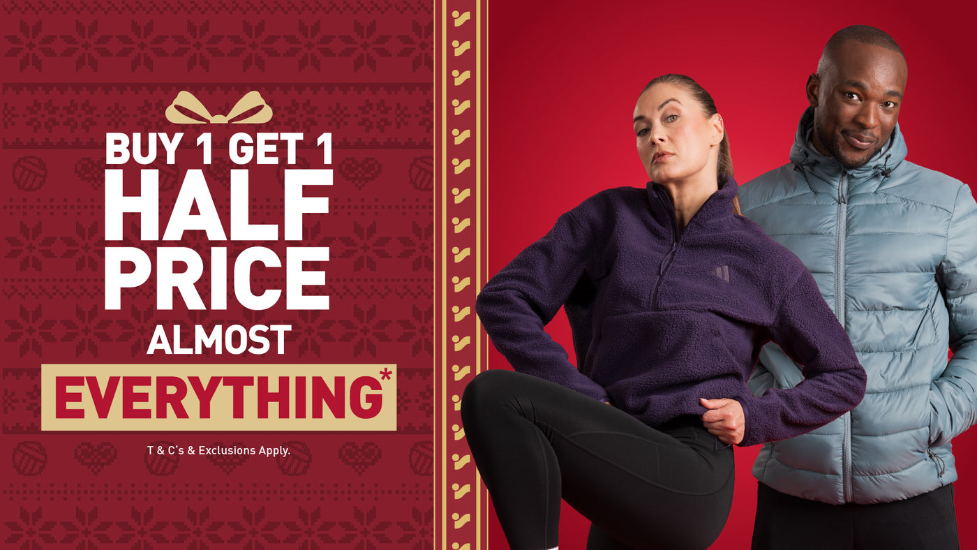 An image of the Intersport Elverys Christmas Black Friday sale offer calling out Buy 1 Get 1 Half Price on almost everything. Features adults wearing products part of the promotion.