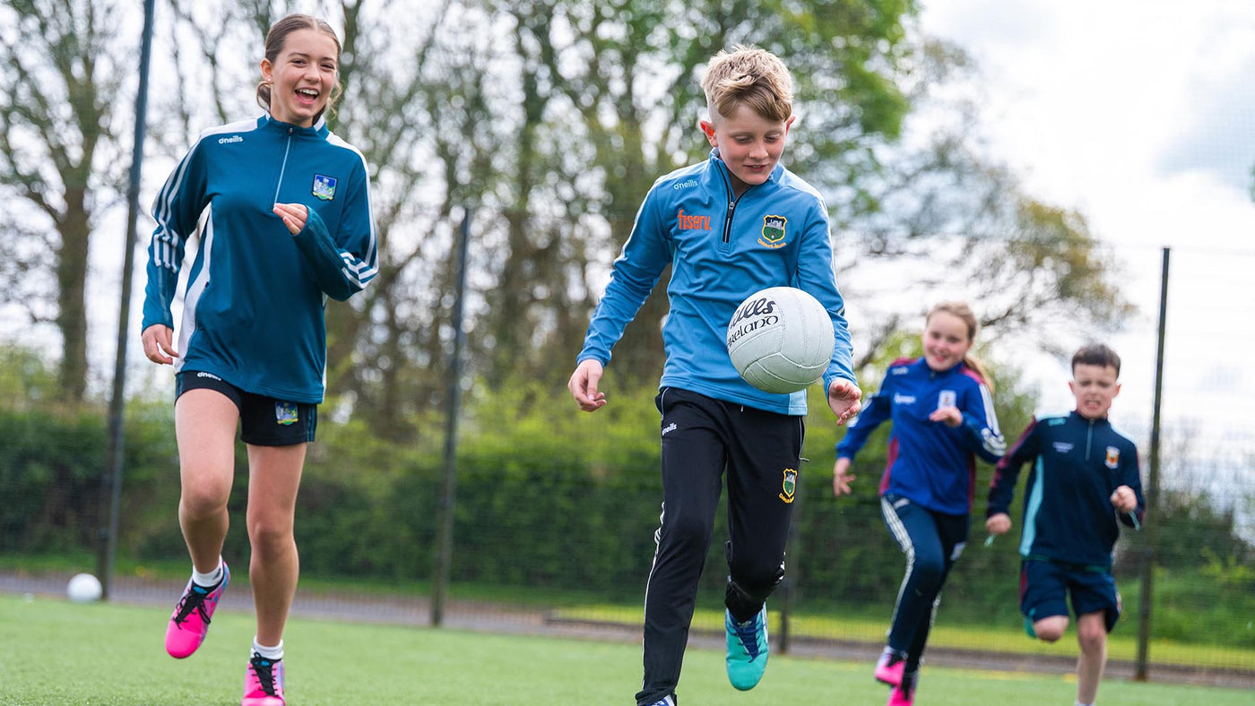 A group of kids playing GAA