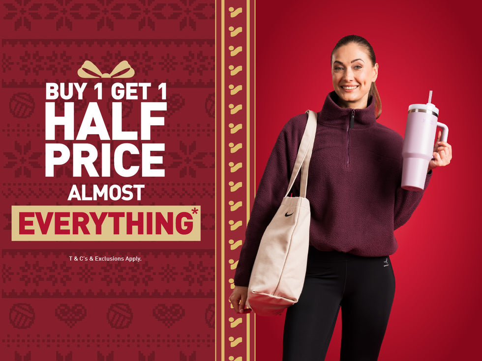 An image of the Intersport Elverys Christmas Black Friday sale offer, calling out Buy 1 Get 1 Half Price on almost everything. Features a women showcasing products as part of the promotion.