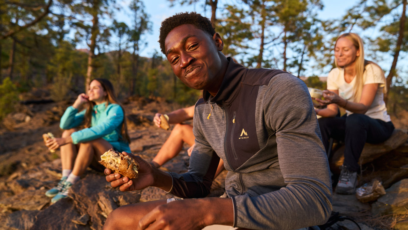 A group of friends enjoying a break whilst out camping