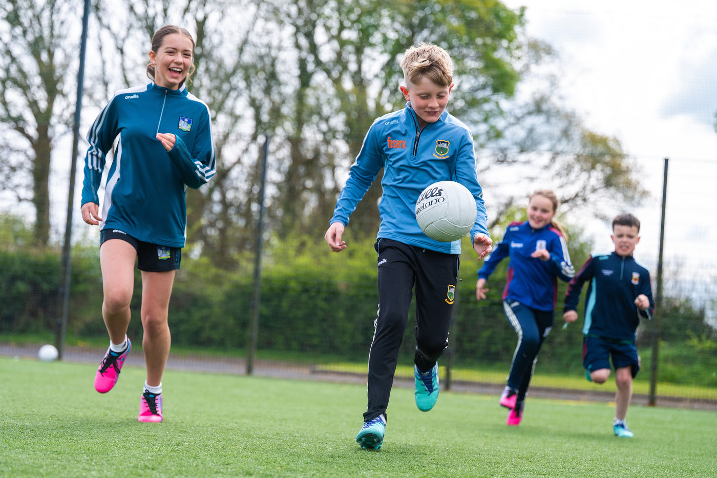 A group of kids playing GAA