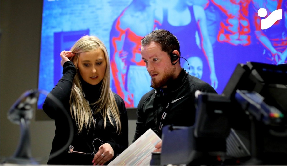 Two staff members in a store