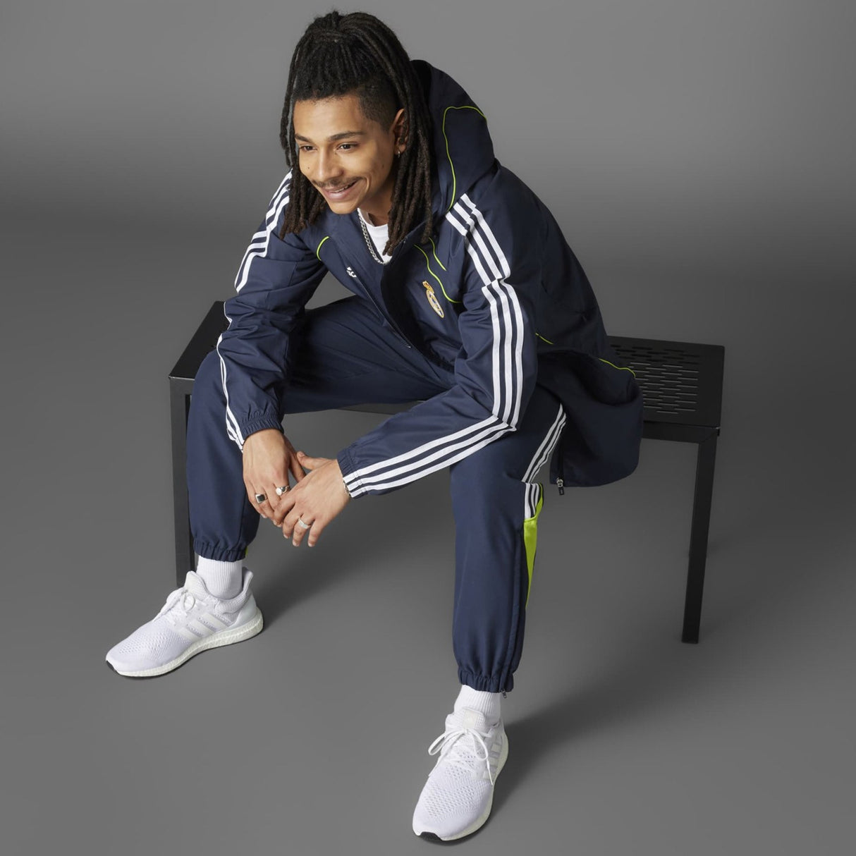 adidas Real Madrid Adults Full-Zip Windbreaker Jacket Model Sitting View Grey Background