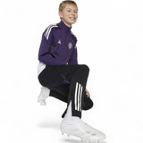 adidas Manchester United Tiro Football 2025/26 Kids Training Pant Model Kneeling Side View