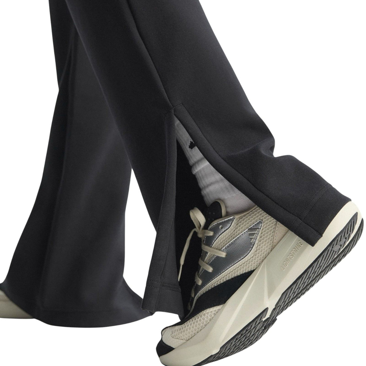 adidas All Season Womens Fleece Slim-Fit Flared Pants Model Close-Up Ankle View