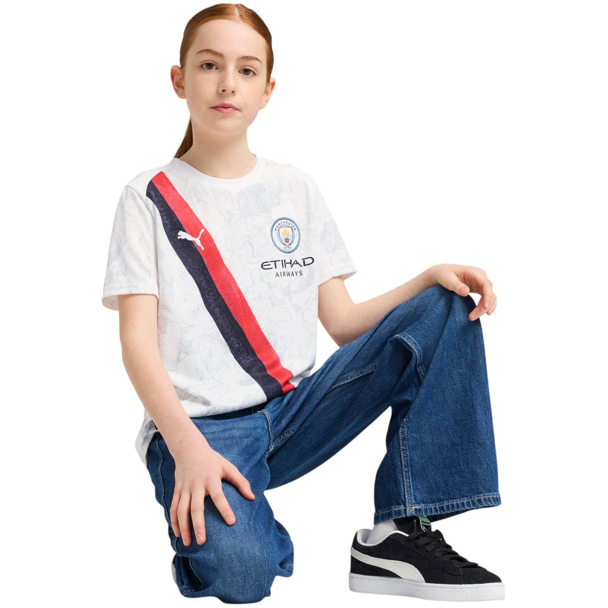 Puma Kidsuper Manchester City Football 2025/26 Kids Jersey Model Kneeling Full-Length View