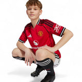 adidas Manchester United Football 2025/26 Kids Short Sleeved Home Jersey Model Kneeling Front View