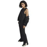 adidas All Season Womens Fleece Slim-Fit Flared Pants Model Full-Length Side View