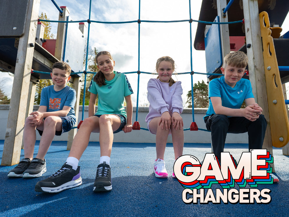 Kids sitting in an outdoor play area posing for the current Intersport Elverys Kids Campaign 2025 - Mobile Image
