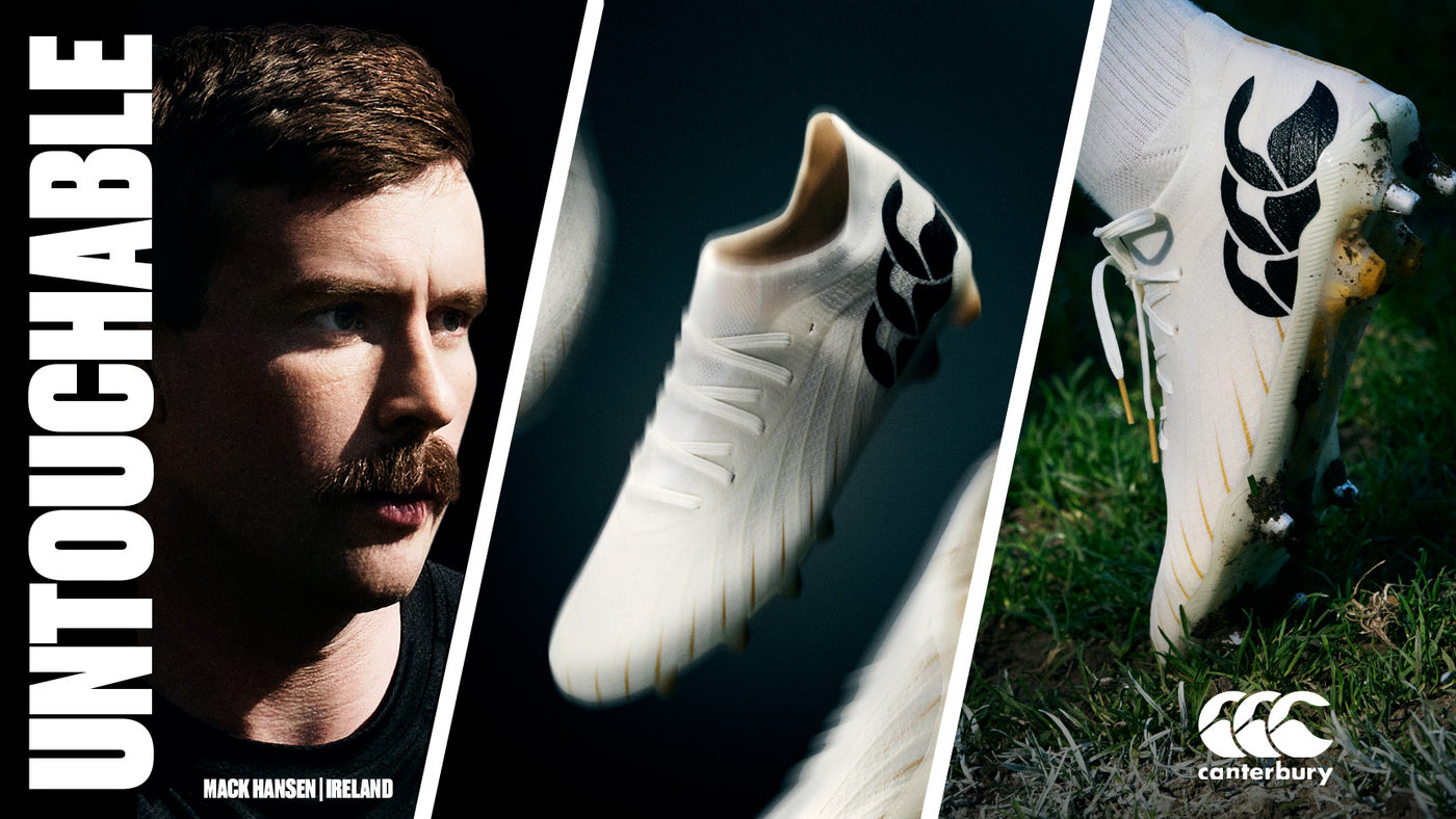 An image of Mack Hansen looking towards the new Canterbury white Rugby boots sitting in the grass with the heel up