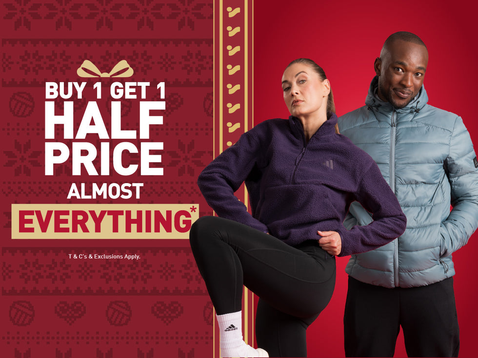 An image of the Intersport Elverys Christmas Black Friday sale offer, calling out Buy 1 Get 1 Half Price on almost everything. Features adults showcasing products as part of the promotion.